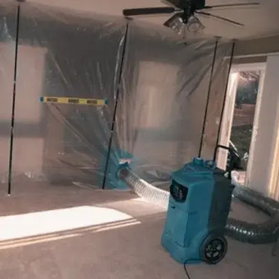 Dehumidifier drying a contained room during a Charlotte water damage job