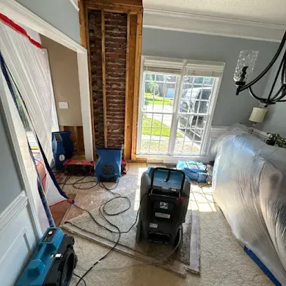 Containment plastic and drying equipment set up in a Charlotte family room