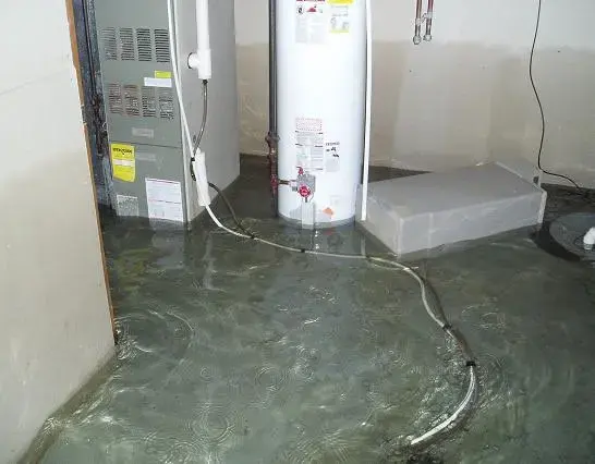 Utility room flooded around a failed water heater and furnace